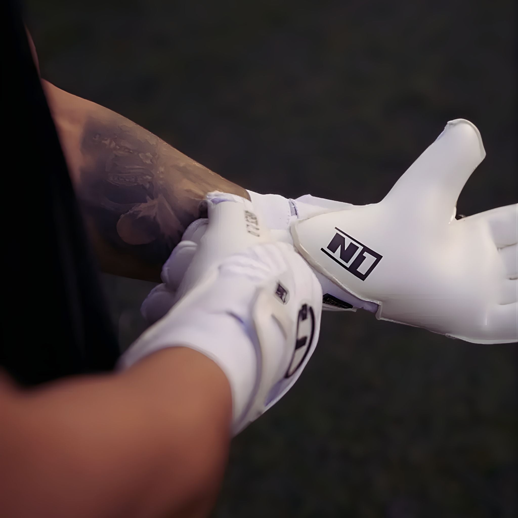 Close-up of N1 Ares 2.0 All White on hands